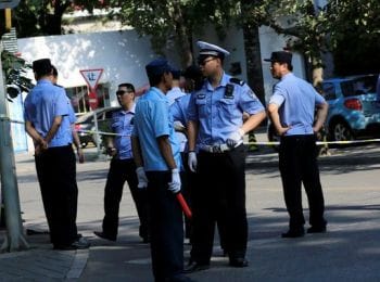 epa05422482 Chinese police officers stand guard at a road block leading up to the Philippines embassy in Beijing, China, 13 July 2016. Heavy security is seen in the area around the Philippines embassy in Beijing after the tribunal at the Permanent Court of Arbitration (PCA) in The Hague ruled on 12 July 2016 against Chinese claims to rights in South China Sea. The PCA declared that a 'nine-dash' line the Chinese government used to delineate South China Sea claims contravenes a United Nations convention on maritime law.  EPA/HOW HWEE YOUNG
