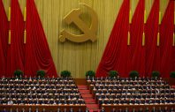 Chinese Communist Party leaders attend  the opening session of 18th Communist Party Congress, while Hu Jintao, no in the picture, Chinese president and current Chinese Communist Party general secretary, reads a work report, whose seat is seen empty in the center of front row, at the Great Hall of the People in Beijing, China, Thursday, Nov. 8, 2012. Preparing to hand over power after a decade in office, China's President Hu Jintao called Thursday for sterner measures to combat official corruption that has stoked public anger while urging the Communist Party to maintain firm political control.  (AP Photo/Alexander F. Yuan)