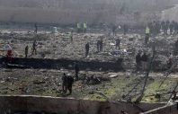 epa08111933 Officials inspect the wreckage site after an Ukraine International Airlines Boeing 737-800 carrying 176 people crashed near Imam Khomeini Airport in Tehran, killing everyone on board, in Shahriar, Iran, 08 January 2020.  EPA-EFE/ABEDIN TAHERKENAREH
